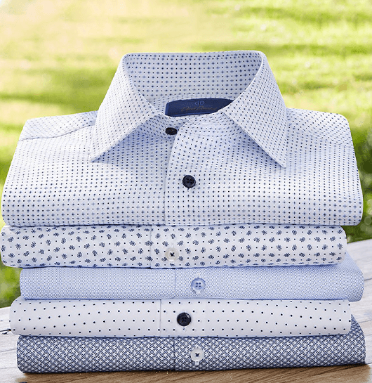 a stack of neatly folded men's dress shirts springfield illinois