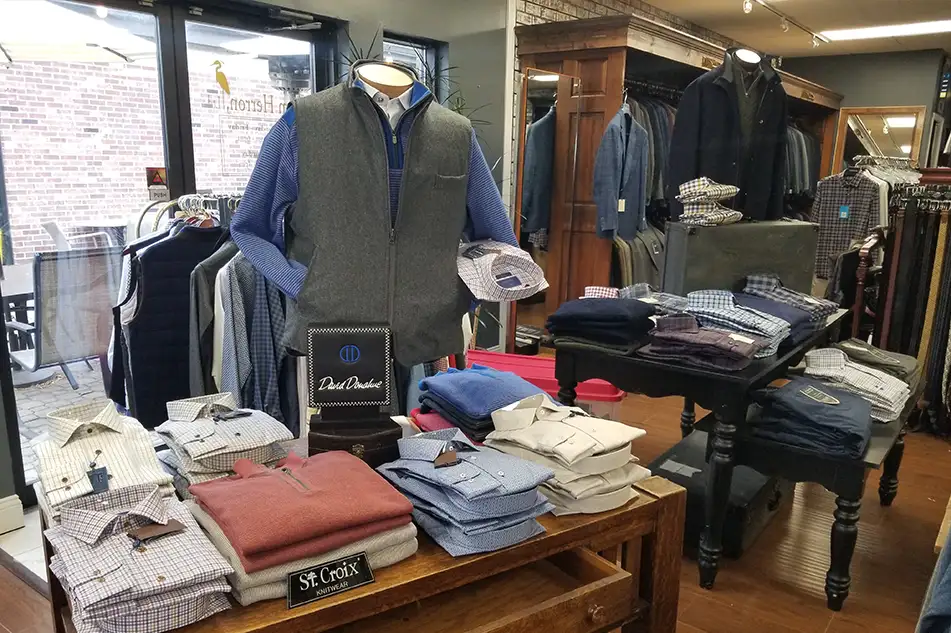 men's clothing store with a table that has different colored dress shirts or sport shirts neatly folded springfield illinois