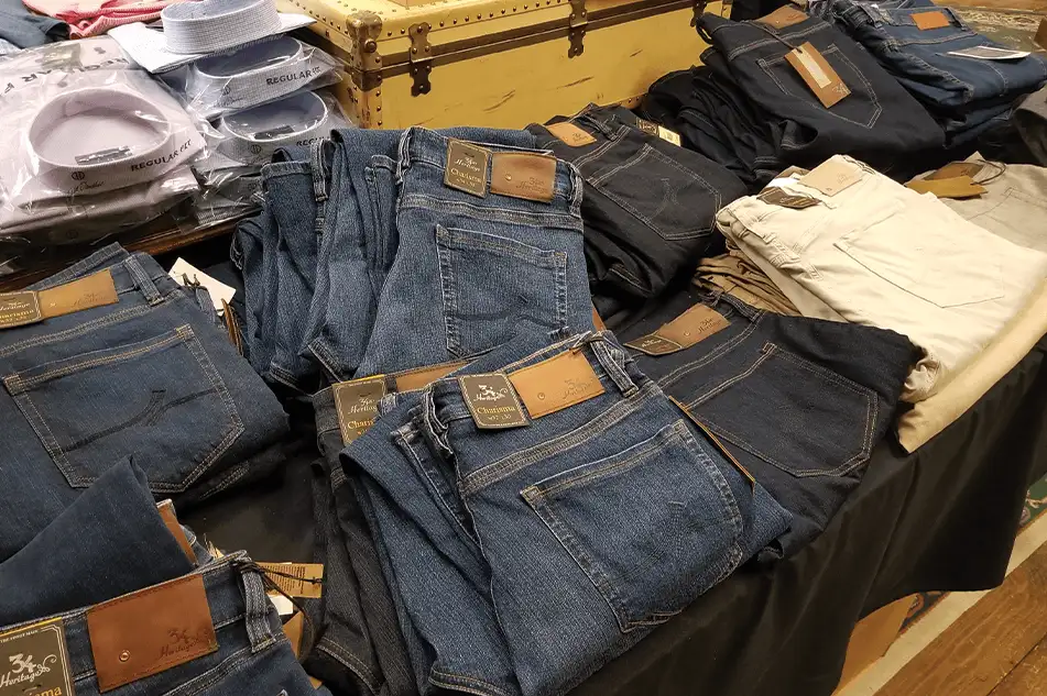 jeans folded in stacks inside a men's casual and formal clothing retail store in springfield illinois'